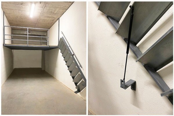 Entreplanta metálica con escalera replegable mediante pistón Entreplanta metálica con escalera replegable mediante pistón